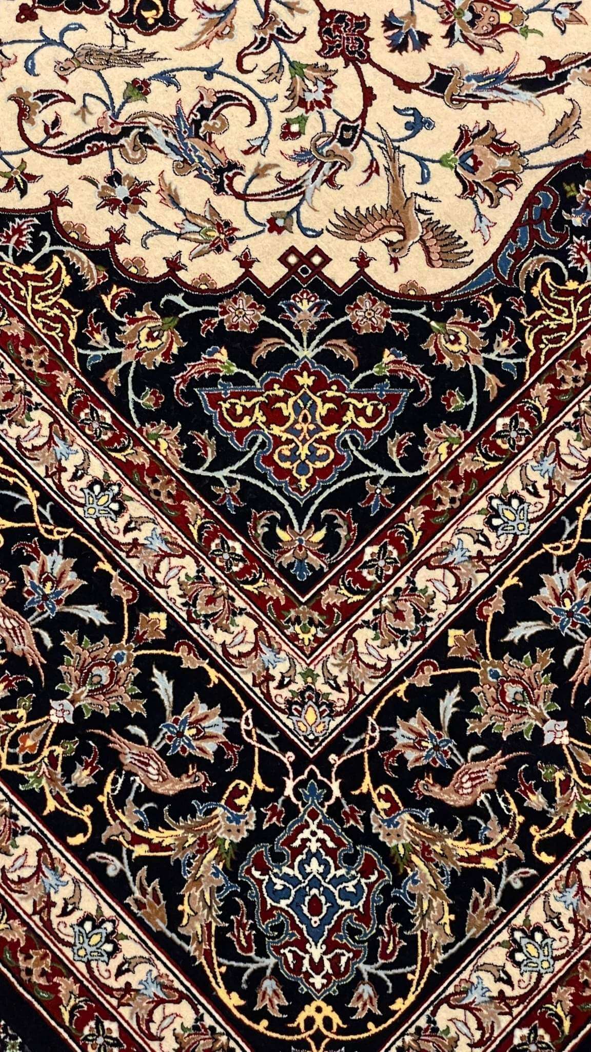 Elegant wool and silk Persian rug featuring vibrant colors and a central medallion design.